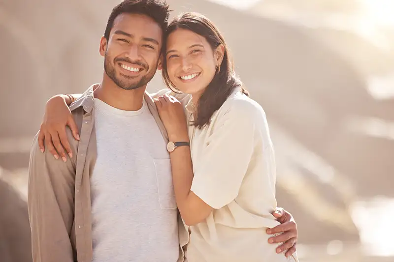 Intended parents embracing after learning about Tandem Surrogacy’s screening and matching process